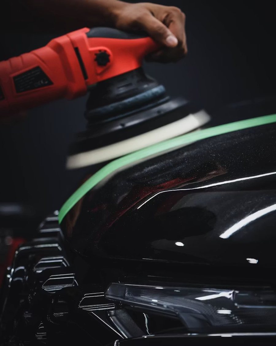 Machine polisher correcting car paint