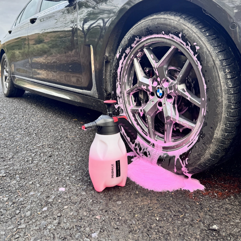 Foam Meister foam cannon by Prismax Car Care Products mounted on a car, ready to spray thick foam for cleaning and detailing.