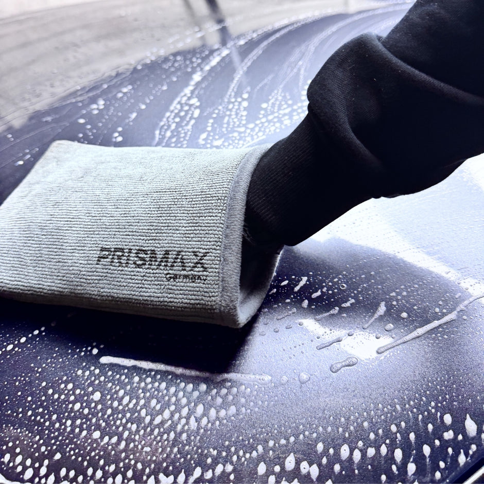 Prismax ClayMitt decontamination mitt for car detailing, showing a soft, textured clay mitt used for removing contaminants from vehicle surfaces.