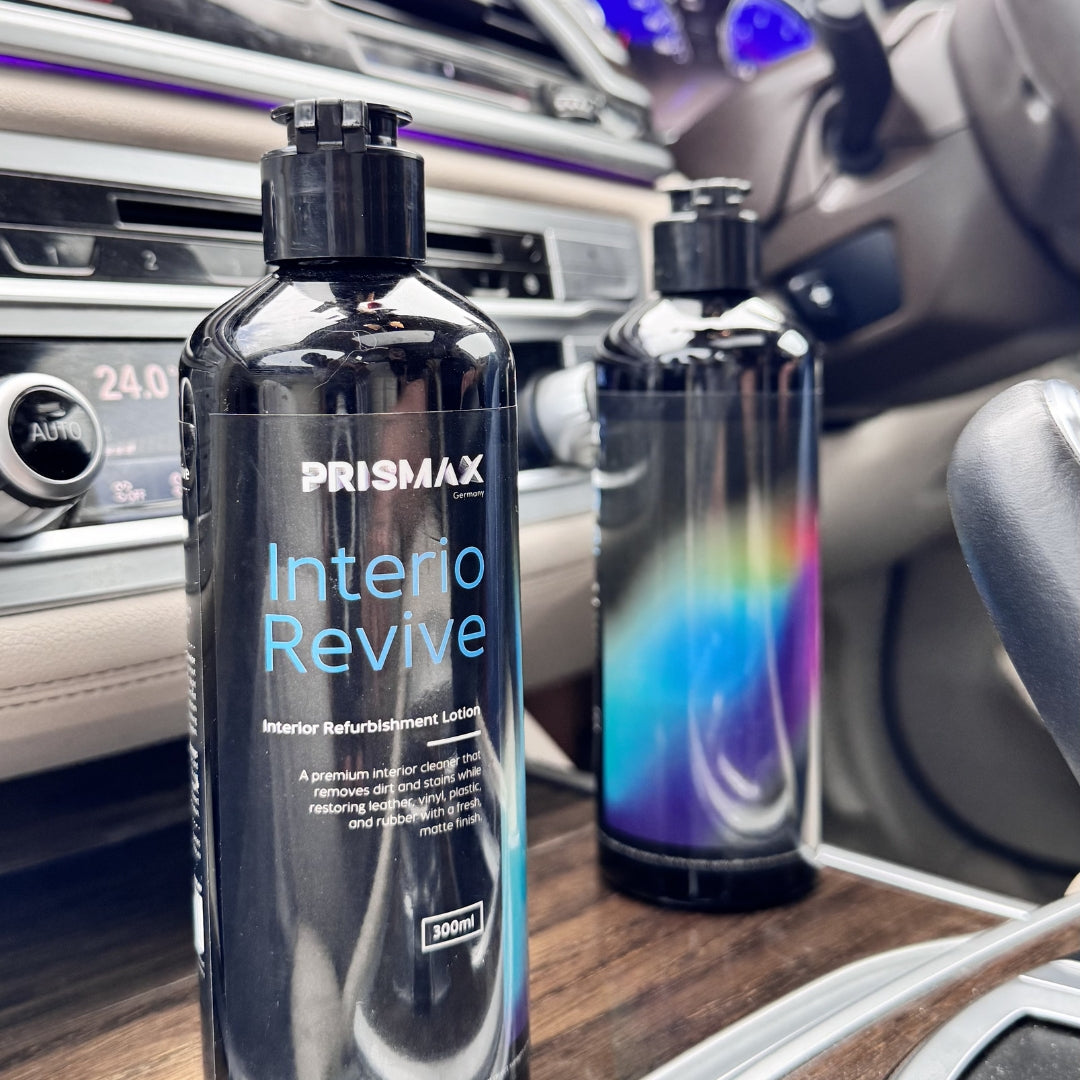 Prismax InterioRevive interior refurbishment lotion applied to car dashboard, showing a clean, refreshed surface with a smooth finish.