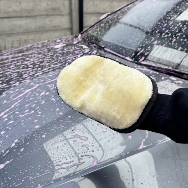 Ultra-soft synthetic wool wash mitt by Prismax for car cleaning, shown in close-up with plush, dense wool fibers ready for washing.