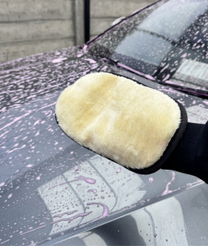 Ultra-soft synthetic wool wash mitt by Prismax for car cleaning, shown in close-up with plush, dense wool fibers ready for washing.
