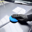 Prismax HyperWax Liquid Wax bottle with applicator pad, showcasing the car care product for a shiny, protected vehicle finish.