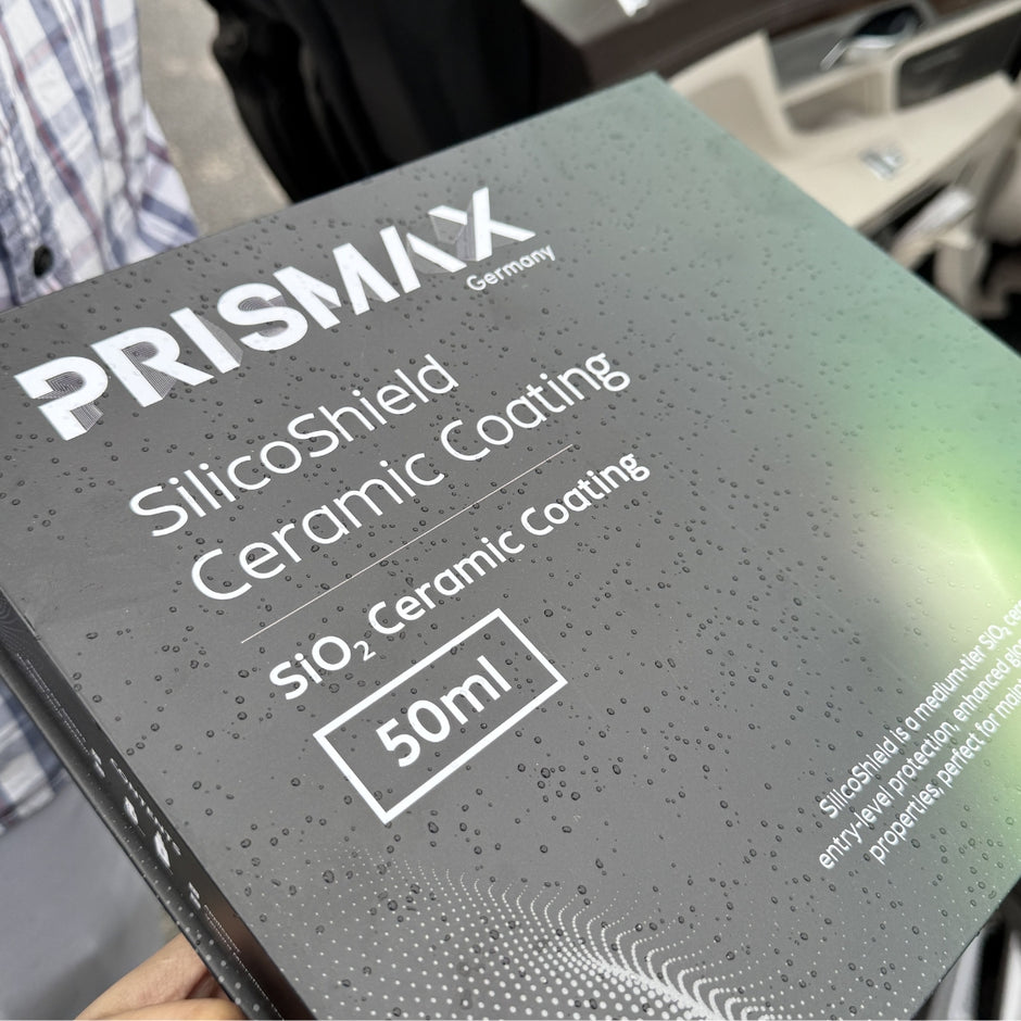 Car with a glossy finish coated in Prismax SilicoShield Ceramic Coating, showcasing enhanced shine and protection.
