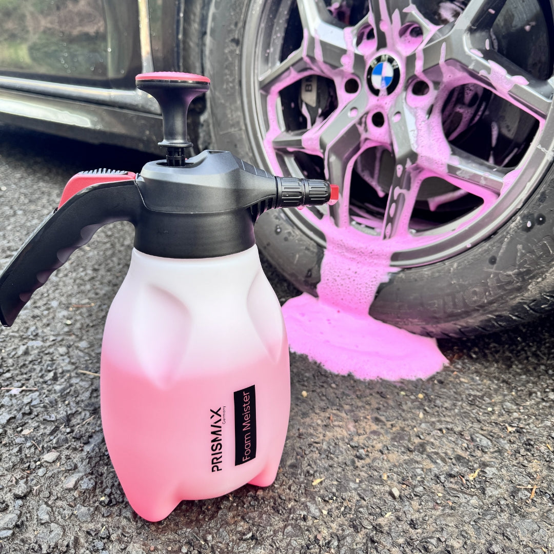 Prismax Foam Meister foam cannon for car washing, showing the white plastic bottle with adjustable nozzle and foam output.