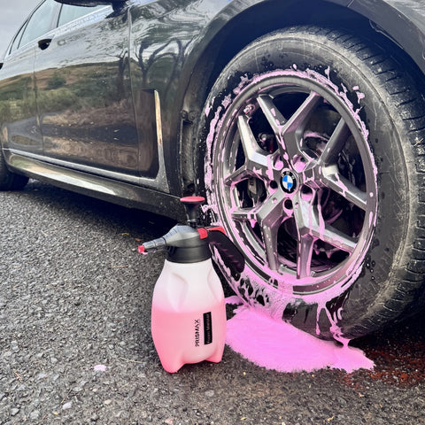 Prismax PlushWash car shampoo pre-cleaner in a white bottle with a blue cap, designed for gentle vehicle cleaning and pre-washing.