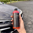 Prismax PlushWash car shampoo bottle with label, showcasing a pre-cleaner for vehicle exterior cleaning and pre-washing.