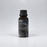 Bottle of Prismax TitanGraphene Ceramic Coating for car protection, featuring a sleek container with product label.