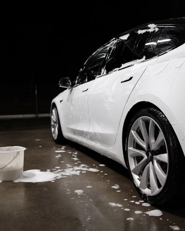 Freshly washed car in a detailing bay